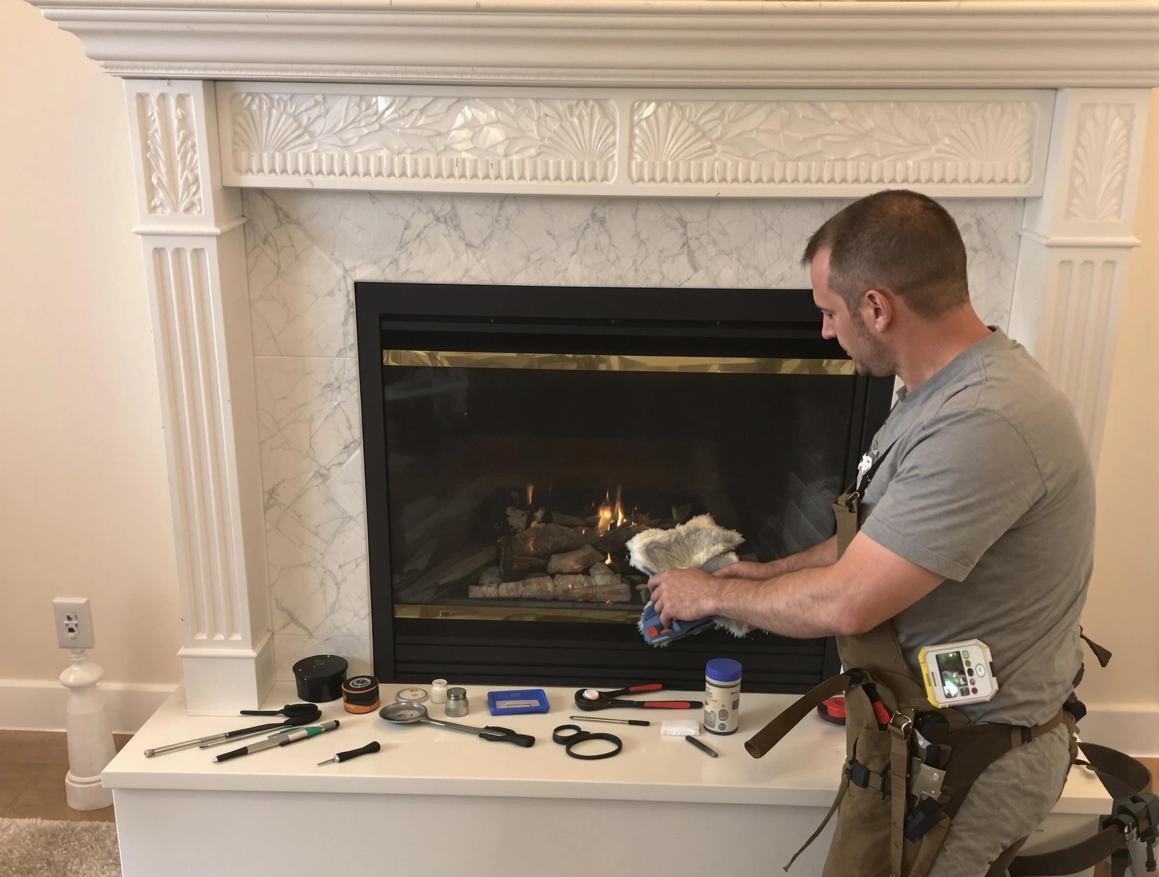 Waltham Chimney Sweep performing fireplace maintenance in Waltham, MA