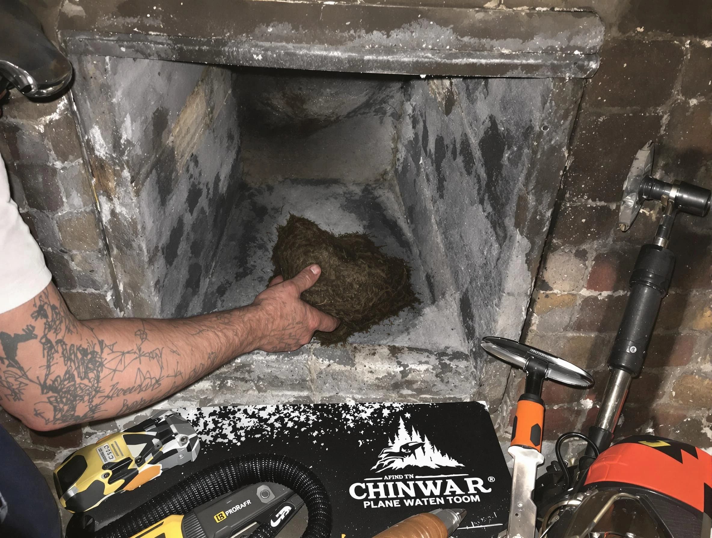 Waltham Chimney Sweep safely removing debris and screening chimney in Waltham, MA